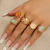 Atuendo de foto de vacaciones transfronterizo europeo y americano con juego de anillos, anillo de moda retro con piedra de ojo de tigre de girasol