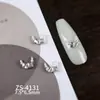 Novos designs de nail art com adornos de zircônia cúbica de alta qualidade, leves e luxuosos, incluindo strass nas pontas dos dedos estilo francês, decorações de unha versáteis e deslumbrantes, e motivos de coração e borboleta