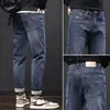 Jeans Masculino de Cintura Alta Tendência Marca de Luxo Corte Reto Solto Primavera/Outono 2026 Novo Versátil Elástico Casual Calça Longa