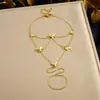 Pulsera de Cadena Fina Dorada Brillante Venta Caliente Transfronteriza Europea y Americana Acero Inoxidable Chapado en Oro Sensación de Alta Gama Joyería para Mano de Mujer