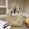 La popular bolsa de mano tejida de nicho de este año para mujer, nuevo bolso de hombro calado de verano 2026, bolsa para axila madre-hija