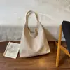 Bolsa de Ombro Única com Textura Trançada Moda Retrô Grande Capacidade Outono 2026 Nova Simples Cor Sólida Alta Aparência Bolsa de Axila Tendência