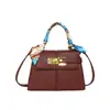 Bolso de mano de nicho para mujer, nuevo modelo de otoño 2026, bolso de hombro casual retro texturizado, bolso pequeño cuadrado cruzado para el día a día