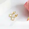 Brincos de trevo de quatro folhas, presilhas de orelha, best-seller transfronteiriço, não desbota, aço titânio 18k, luxo leve, moda, estilo Ins, unissex e versátil