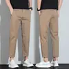 Nuevos Pantalones Casuales Versátiles de Estilo Coreano Juveniles Transpirables Elásticos de Corte Slim para Hombre Primavera y Verano Pantalones Cortos