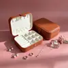 Pronta Entrega Caixa de Joias em Couro PU Caixa Portátil para Armazenamento de Acessórios Caixa para Armazenamento de Três Anéis Dourados Colares Pulseiras