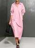 Enviado. Nuevo modelo europeo y americano de Amazon. Vestido de color liso holgado de manga larga con cuello y bolsillo