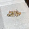 Pendientes de amor con circonita irregular plisada de venta caliente transfronteriza diseño personalizado pendientes estilo ins pendientes de网红 pendientes al por mayor