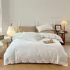 2025 Estilo Botão Estilo Sem Estampa Lençóis de Cama Amigáveis à Pele e Lençóis de Cama com Elástico Conjunto de Quatro Peças Conjunto de Três Peças de Algodão Lavado Japonês Luxo Acessível Ins