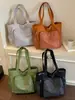 Bolsa de mano Shuai Mi Jia de gran capacidad 2026 nueva de moda bolso de mano simple moda femenina bolso de hombro casual