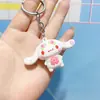 Llavero Sanrio de flor de cerezo rosa, colgante de perro Yugui, adornos de estilo lindo, accesorios para llaves de coche de dibujos animados, regalo