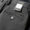 Estación europea otoño e invierno algodón grueso elástico lavado pantalones para hombre cintura media rectos holgados pantalones casuales de negocios para hombre