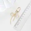 Llavero Colgante para Bolso con Cinta de Lazo Pintada de Doble Cara, Accesorios para Estuche de Audífonos, Estilo Coreano Lns, Color Caramelo, Hebilla de Puerta