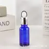 Botella de Vidrio Azul para Aceite Esencial al por Mayor 20ml Botella de Esencia 30ml Botella con Gotero de Punta de Spray Plástica a Prueba de Luz