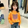 Camiseta versátil de manga larga de algodón puro a la moda estilo coreano para niños, nuevo estilo de otoño, linda camiseta interior de dibujos animados para niñas y niños pequeños