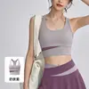 Conjunto de outfit de yoga de cintura alta, sujetador deportivo a prueba de impactos, minifalda plisada anti-exposición, conjunto de fitness Pilates para mujer