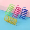 Fábrica en stock bola de juguete para gatos que golpea cruzada suministros para mascotas color gato plástico resorte juguete para gatos