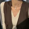 Collar de circonita cúbica estilo coreano, completamente incrustado con piedras brillantes, con un colgante de perla sintética, una cadena de clavícula simple y elegante