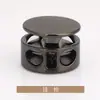 Hebilla elástica de cordón de metal cilíndrica de dos agujeros con forma de mina terrestre, hebilla de resorte T5237