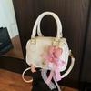 Bolso pequeño de alta gama de comercio exterior para mujer, bolso bandolera de moda de primavera y verano 2025, bolso de bolos portátil de estilo coreano.