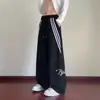 Pantalones de pierna ancha holgados versátiles de moda Harajuku para otoño para hombres y adolescentes, pantalones a rayas de moda estilo Hong Kong ins