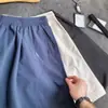 Pantalones cortos deportivos de verano para hombre, retazos de corte diagonal, funcionales para exteriores, holgados, casuales, de seda helada, secado rápido, hasta la rodilla