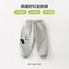 Calça de Treinamento Luomi Coelho 2026 Primavera Nova Desenho Animado Fofo Infantil Macia Calça para Correr Pular Roupa Externa Genuína Calça de Menino