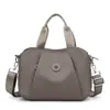 2026 Nuevo Bolso de Mano Ligero de Gran Capacidad Estilo Sencillo para Mujer Versátil para el Trabajo Diario Bolso de Hombro Único Cruzado Bolso de Nylon para Mamá
