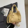 Bolso de cubo de mano popular transfronterizo para mujer, nuevo bolso de hombro versátil de lujo ligero de verano 2026, bolso cruzado moderno y simple