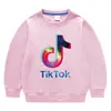 Primavera e Outono de 2026 Cor Sólida Estilo Coreano Nova Roupa Infantil Gola Redonda Moletom Manga Longa de Algodão para Meninos e Meninas