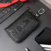 Bolsa para Chave de Carro em Couro Genuíno Couro de Vaca Zíper Chaveiro para Homens e Mulheres Alto Padrão Exquisita Bolsa de Chave Cabeça de Crocodilo Pendurada na Cintura Nova
