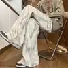 Calças tie-dye estilo americano para homens, adequadas para primavera, outono e inverno, calças casuais largas de corte solto com um visual descolado e desgastado, calças retas de alta resistência