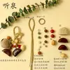 Kit de material DIY para fazer um móbile de casca de fruta, um sino pendurado de cura, com frutas pretas indonésias, estramônio, lírio d'água e rotim