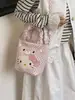 Bolso de mano Hello Kitty para mujer 2026 nuevo bolso tipo cubo de dibujos animados con un toque de alta gama, adecuado para ir al trabajo, bolso de hombro y cruzado de lunares