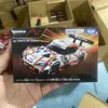 2026 Nuevo Producto Tomy Tomica Modelo de Coche de Aleación No. 98 Tesla Model 3 Bus Actualización de Enero