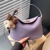 Bolsa pequena de mão com textura de comércio exterior retrô feminina 2026 nova de nicho moderna de ombro único transversal