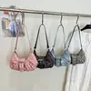 Nuevo estilo retro americano de viajero, bolsa de mano grande de pliegues para el verano 2026, bolso de hombro simple para mujer