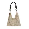 La popular bolsa de cubo dulce de mano para mujer de este año es el nuevo estilo de verano 2026, bolso de hombro tejido calado, bolso versátil para debajo del brazo