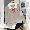 Broche de lazo, bordado de cachorro, suéter de punto de manga larga para solapa, nuevo jersey de estilo universitario otoño e invierno 2026 para mujer
