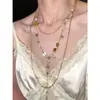 Collar vintage de flor dorada y borla de perlas, único y elegante, collar multicapa de alta gama