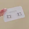 Pendientes de perlas con lazo elegantes de primavera para mujer, pendientes atmosféricos de sentido avanzado, pendientes únicos de lujo y nicho.