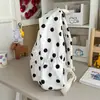 Mochila de estilo coreano con lunares y un fresco dije de tulipán, una bolsa escolar de gran capacidad, una mochila versátil y casual para estudiantes