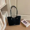 Bolso tote nuevo estilo coreano con estampado de leopardo para principios de otoño de 2026, bolso de hombro de gran capacidad para el trabajo y los desplazamientos, bolso de mano simple y único