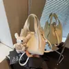 Bolsa de balde portátil popular transfronteiriça para mulheres, nova bolsa de ombro versátil de luxo leve para o verão de 2026, bolsa transversal moderna e simples