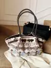 Bolso de Mano Portátil Nuevo Lindo Otoño/Invierno 2025 Bolso de Maquillaje de Moda Tendencia Bolso de Viaje Bolso de Hombro Simple de Nicho