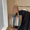 Bolsa Feminina de Comércio Exterior 2025 Nova Moda Bolsa de Lona Listrada Grande Capacidade Bolsa de Ombro Portátil para o Dia a Dia Bolsa Tote Transversal