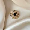 Broche de estilo antiguo nuevo de alta gama ins para mujer estilo chino abanico borla pin de traje cheongsam tapeta de presión corsage al por mayor