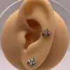 Venta Caliente Aretes Corona de Flores de Titanio F136 Clavos de Labio de Aleación de Titanio Clavos de Cartílago Auricular Clavos Cocleares Joyería para Perforación Corporal