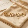 Nuevo juego de cuatro piezas de clip para oreja de perla de lujo ligero de moda transfronteriza de Amazon, pendientes versátiles y elegantes para mujer