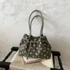 Bolso de lunares súper popular transfronterizo para mujer 2026 nuevo bolso versátil de hombro y axila bolso informal de doble hombro para el trabajo